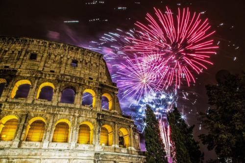 New Year's fireworks in the sky by the Colosseum in Rome